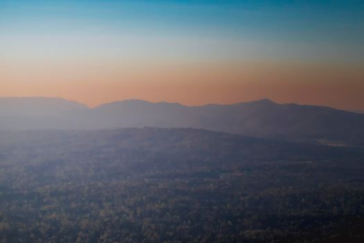Panorama of a beautiful landscape with mountain ranges at sunset.  At Khao Yai National Park Thailand