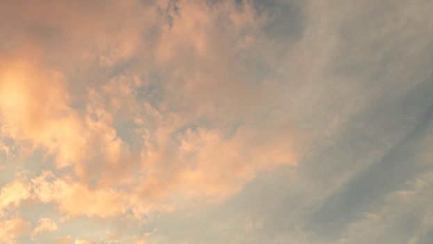Dramatic clouds at sunset with cityscape silhouette. Abstract season weather vacation time.