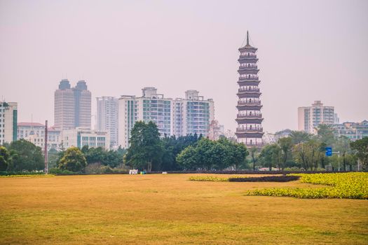 December 2019 Guangzhou China landscape urban design in city with scenic of high-rise building and main tourist attraction named The Temple of the Six Banyan Trees or Liurong Temple .