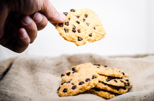 hand take a Chocolate Chip Cookie Bakery Cheesecake Baking sweet food snack object still life