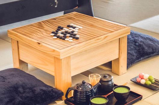 Traditional Japanese Tabletop Go strategy Games with green tea set