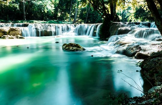 Long exposure of Huay Mae Khamin Waterfall in Srinakarin Dam National Park. Kanchanaburi Thailand. cascade waterfall tropical forest