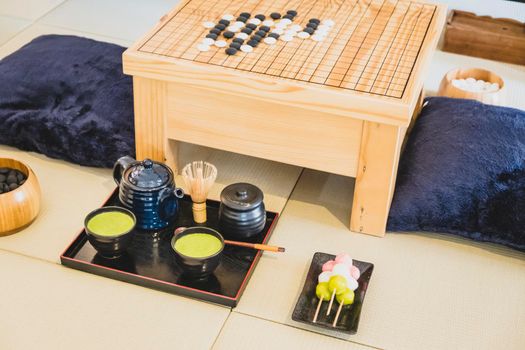 Traditional Japanese Tabletop Go strategy Games with green tea set