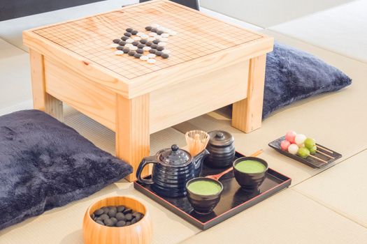 Traditional Japanese Tabletop Go strategy Games with green tea set
