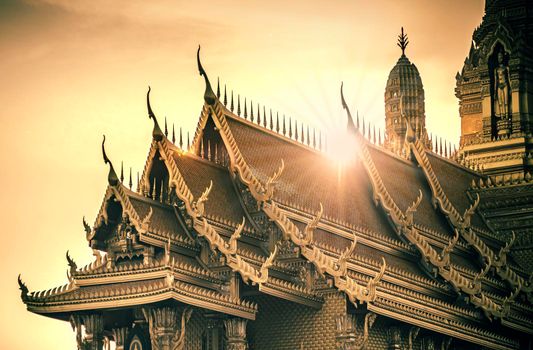 Roofs in Thai architecture kind of temple palace over sunset or sunrise. Building religion in Thailand