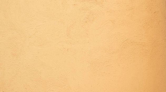 Yellow orange Beige painted stucco wall construction. Pattern Background texture.