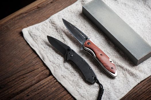 Sharpen the pocket knife with grindstone or whetstone. Pocket knife care and maintenance.