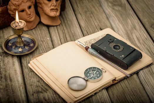 Traveler's accessories and costume on wooden background with copy space , travel concept