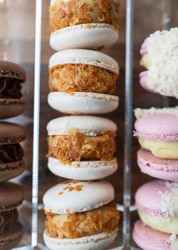 Pile of colorful macaroons - french sweet treat, close-up, top view. French sweets concept