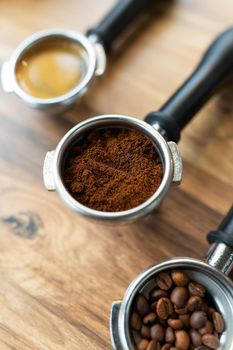 Different processes of preparing coffee by a barista in a coffee shop. Coffee beans, ground, ready. Coffee art concept