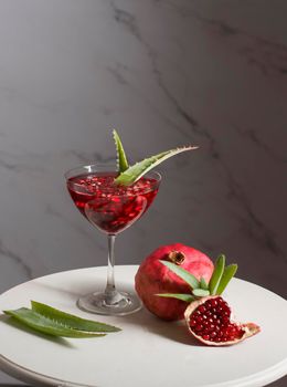 alternative medicine, pomegranate juice with aloe vera, still life, delicious medicine. High quality photo