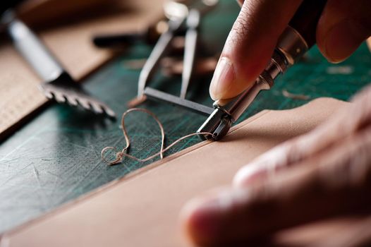 Working with vegetable tanned leather. Leather and the craft tools.