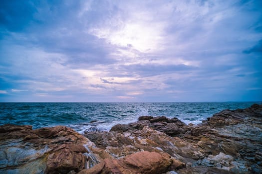 Sea Ocean with Smooth Wave and Rock landscape with blue sky. Nature of Seascape vacation time.