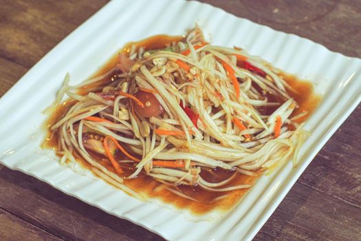 Som tum Thai best dish is vegetarian papaya spicy salad food in Thailand. Ingredient are vegetable lemon tomato papaya lime shrimp.