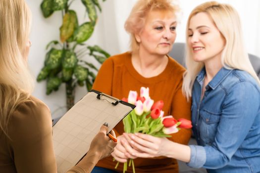 Talking is key to understanding. Parent and child seeing psychologist together. Counseling therapist and mother listening to preteen daughter sharing school news, telling story and answering questions