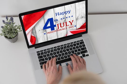 man searching website with information of the celebration of Independence Day hands of a man looking in web a site with information of 4th July. High quality photo