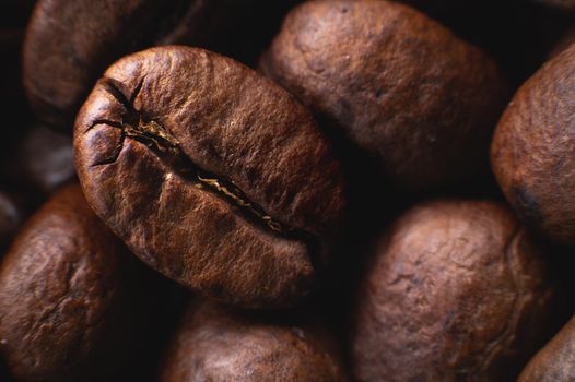 Close-up Coffee roasted beans. Extreme macro coffee background.