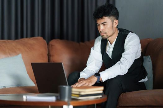 Portrait of Asian Businessman checking schedule and waiting for meet customer
