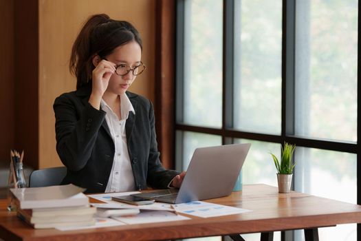 Image of Young woman working online on laptop computer. studying or working from home online concept