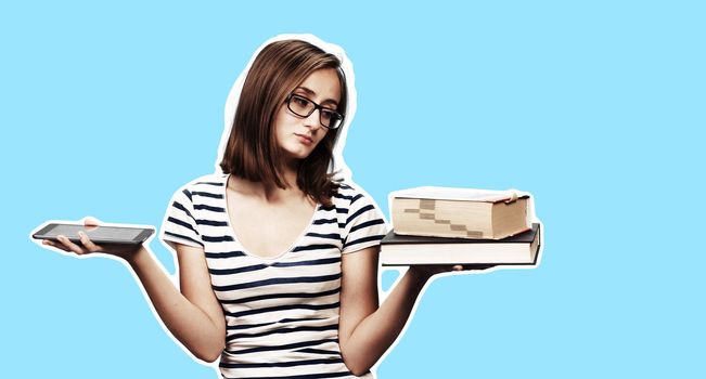 Contemporary education concept. Book vs e-book. Girl student holding traditional textbook and ebook reader on blue background with copy space. Magazine style collage