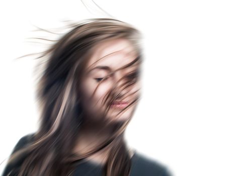 Blurred image of a young woman with closed eyes. Isolated on white with copy-space. Intentional motion blur.