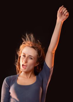 Portrait of emotional girl with her hand raised