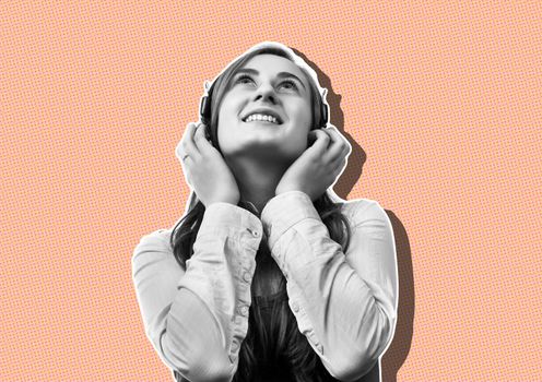 Lifestyle concept. Young happy woman listening to music on headphones. Magazine style collage with copy space and trendy coral color background