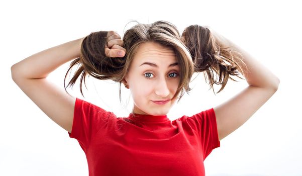 Young woman playing with her ​​hair on white background
