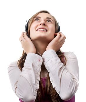 Girl listening to music in headphones
 isolated on white background