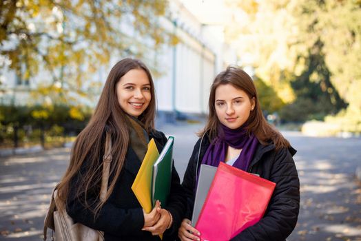 Portrait of two female students in campus