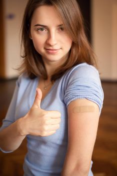 Smiling female student successfully vaccinated