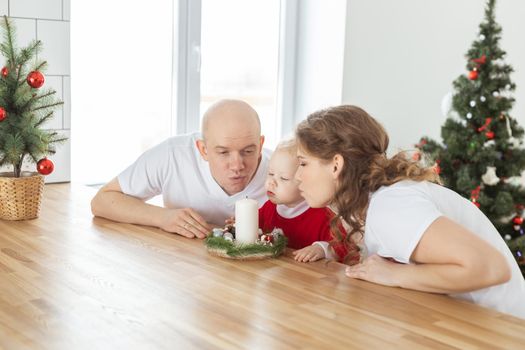 Child girl dressed in christmas dress with cochlear implants having fun at home - hearing aid and innovating technologies for treatment deafness