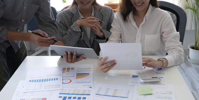 Asian business adviser meeting to analyze and discuss the situation on the financial report in the meeting room.Investment Consultant,Financial Consultant,Financial advisor and accounting concept.