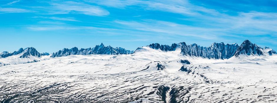 Broad high definition view of majestic and jagged mountains of Thompson Pass near Valdez in Alaska