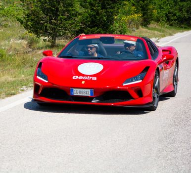 URBINO, ITALY - JUN 16 - 2022 : FERRARI TRIBUTE IN an old racing car in rally Mille Miglia 2022