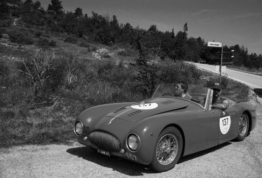 URBINO, ITALY - JUN 16 - 2022 : CISITALIA 202 S MM SPIDER NUVOLARI 1947 on an old racing car in rally Mille Miglia 2022 the famous italian historical race (1927-1957