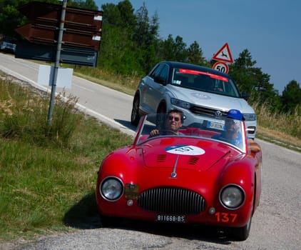 URBINO, ITALY - JUN 16 - 2022 : CISITALIA 202 S MM SPIDER NUVOLARI 1947 on an old racing car in rally Mille Miglia 2022 the famous italian historical race (1927-1957