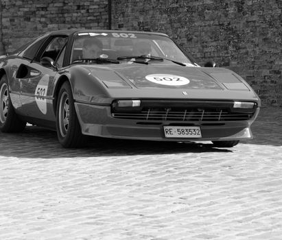 URBINO, ITALY - JUN 16 - 2022 : FERRARI TRIBUTE Ferrari 308 Gts IN an old racing car in rally Mille Miglia 2022