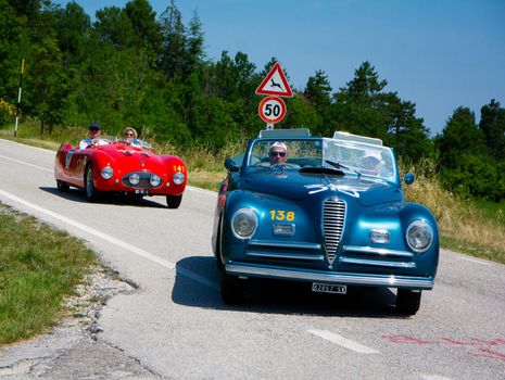 URBINO, ITALY - JUN 16 - 2022 : ALFA ROMEO 6C 2500 S CABRIOLET PININ FARINA 1947 on an old racing car in rally Mille Miglia 2022 the famous italian historical race (1927-1957