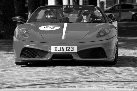 URBINO, ITALY - JUN 16 - 2022 : FERRARI TRIBUTE Ferrari Scuderia Spider 16M IN an old racing car in rally Mille Miglia 2022