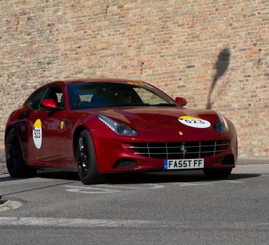 URBINO, ITALY - JUN 16 - 2022 : FERRARI TRIBUTE Ferrari Ff IN an old racing car in rally Mille Miglia 2022