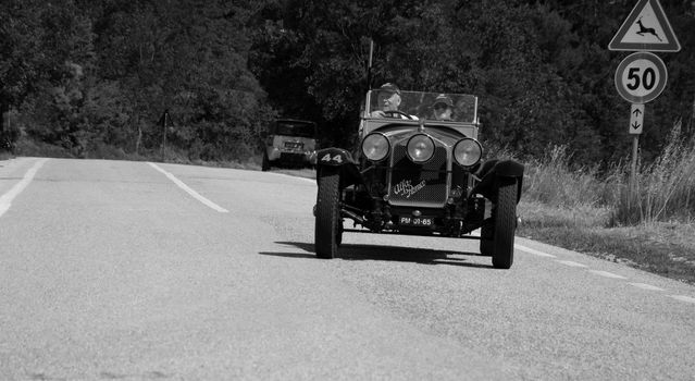 URBINO, ITALY - JUN 16 - 2022 : ALFA ROMEO 6C 1750 SUPER SPORT ZAGATO 1929 on an old racing car in rally Mille Miglia 2022 the famous italian historical race (1927-1957