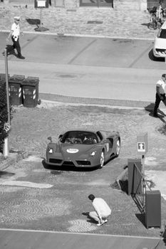 URBINO, ITALY - JUN 16 - 2022 : FERRARI TRIBUTE Ferrari ENZO IN an old racing car in rally Mille Miglia 2022