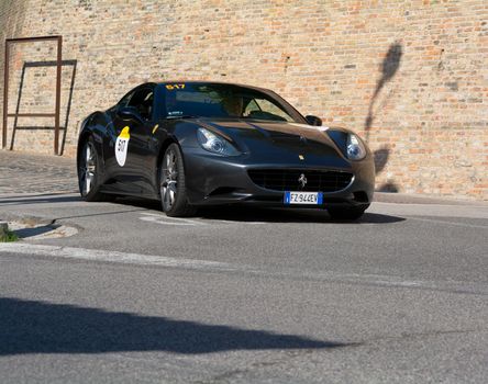 URBINO, ITALY - JUN 16 - 2022 : FERRARI TRIBUTE Ferrari 250 California IN an old racing car in rally Mille Miglia 2022