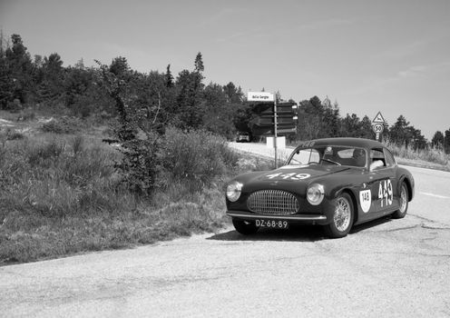 URBINO, ITALY - JUN 16 - 2022 : CISITALIA 202 SC BERLINETTA PININ FARINA 1948 on an old racing car in rally Mille Miglia 2022 the famous italian historical race (1927-1957