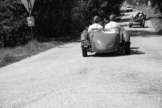 URBINO, ITALY - JUN 16 - 2022 : ASTON MARTIN 2 LITRE SPEED MODEL 1937 on an old racing car in rally Mille Miglia 2022 the famous italian historical race (1927-1957