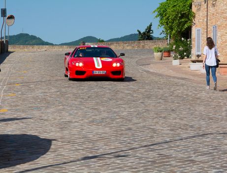 URBINO, ITALY - JUN 16 - 2022 : FERRARI TRIBUTE Ferrari MODENA IN an old racing car in rally Mille Miglia 2022