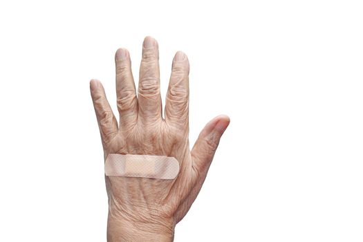 Elderly woman adhesive bandage on her hand