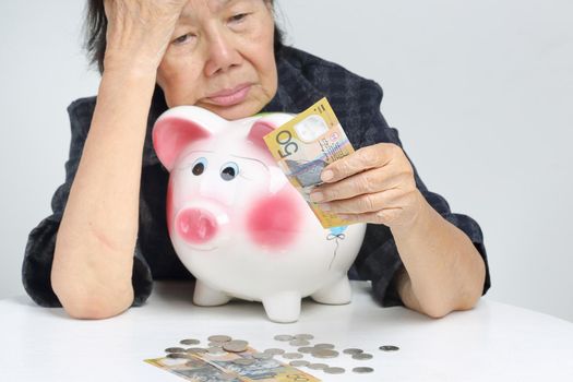 elderly woman has little money