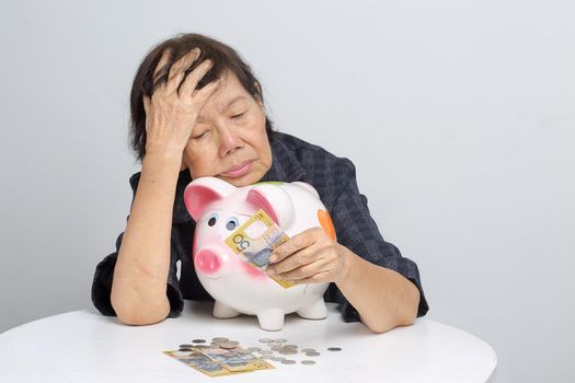 elderly woman has little money